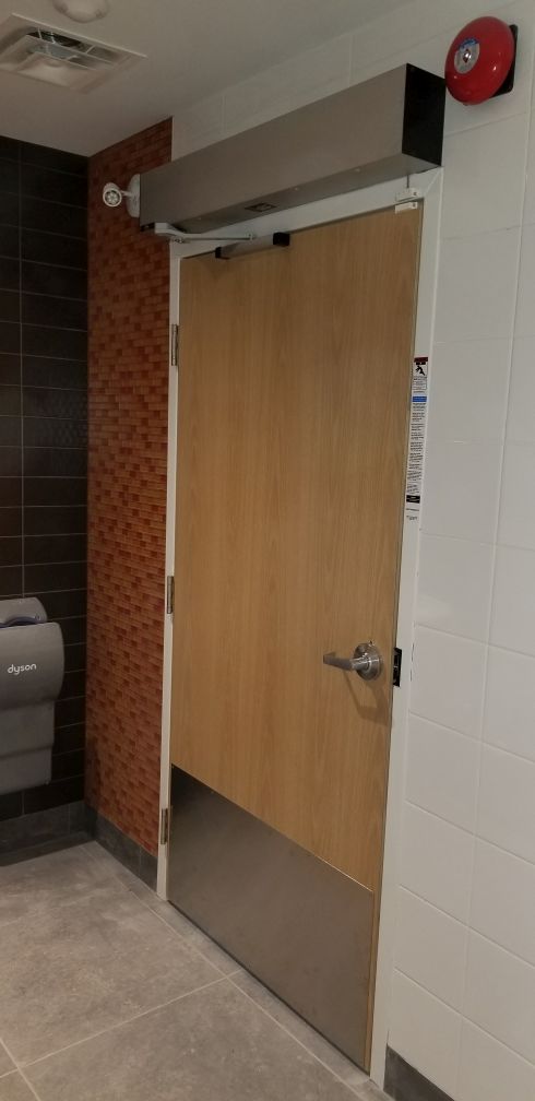Universal washroom automatic door operator